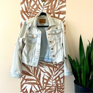 Distressed denim jacket